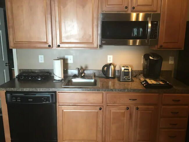 Living room - 9819 Glenburn Ln Apartments