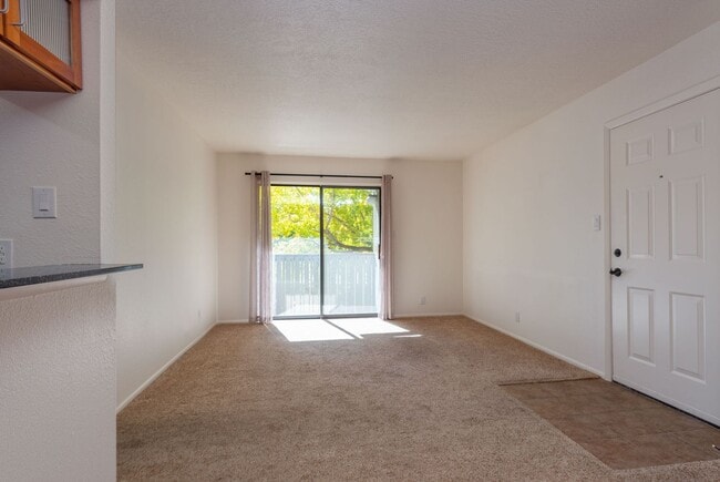 Building Photo - Light and Bright Second Level Condo Availa...