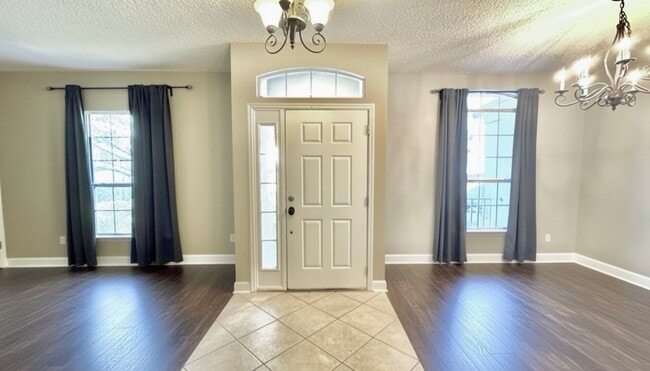 Building Photo - 4 Bed, 3 Bath, Corner Lot Home with Lanai, Fireplace, and Plenty of Community Amenities! Waived A...