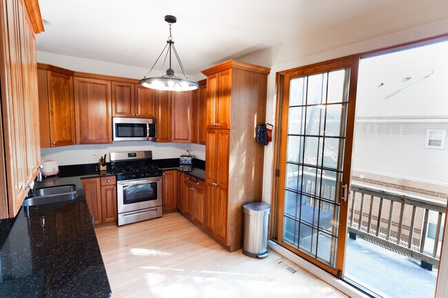 Beautiful galley kitchen with brand new stainless steel appliances - 2655 W Rice St