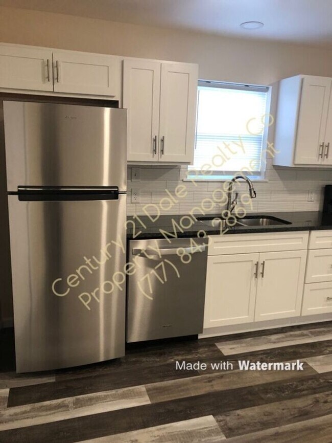 Building Photo - Newly Renovated 2 BR Townhome in Dover Sch...