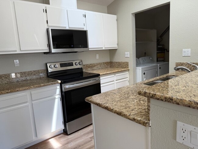 Building Photo - REMARKABLE REMODELED 2 BED/1/5 BATH CONDO ...