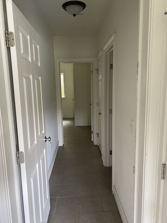 Hallway to family room and full bathroom - 303 Landon Way