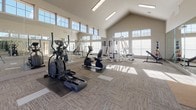 This well-appointed fitness center is designed to offer a comprehensive workout environment within a bright, open layout. The space is defined by soaring vaulted ceilings that create an airy, expansive atmosphere, complemented by rows of large clerestory windows along the upper walls that flood the interior with natural light throughout the day.

The flooring consists of neutral, textured carpet tiles arranged in a geometric pattern, providing comfortable traction underfoot. Floor-to-ceiling mirrors line one full wall, visually doubling the perceived depth of the room while allowing users to monitor their form during exercise.

The cardio zone features multiple treadmills positioned along the mirrored wall, along with elliptical trainers and a recumbent bike, each benefiting from natural light and open sightlines. The strength training area is equipped with a multi-station cable machine, a weight bench, and additional resistance equipment, all arranged to maximize usable floor space.

A set of elegant French doors with glass panes provides access to the space, reinforcing the bright, welcoming character of the room. Medicine balls and other accessories are neatly stored along the walls. The overall ambiance is clean, modern, and functional, suited for a wide range of fitness activities.