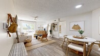 Located in Mesa, Arizona, this thoughtfully designed 2-bedroom, 2-bathroom single-floor home offers a comfortable and functional layout with modern finishes throughout. The open-concept living and dining area is bright and welcoming, featuring wood-look plank flooring, a ceiling fan, and a sliding glass door that fills the space with natural light and provides outdoor views. A built-in shelving nook adds both character and practicality to the living area. The kitchen is well-equipped with gray shaker-style cabinetry, white quartz countertops, stainless steel appliances, and a skylight that brightens the space. A peninsula with bar seating connects the kitchen to the dining area, creating a seamless flow ideal for entertaining. The primary bedroom is generously sized, featuring plush carpet, a ceiling fan, large windows with outdoor views, and access to a walk-in closet. The second bedroom is equally comfortable with similar finishes. Both bathrooms are finished with gray vanities, white quartz countertops, wood-look tile flooring, and shower-tub combinations. A hallway and additional closet provide ample storage. The overall aesthetic is clean, modern, and cohesive throughout.