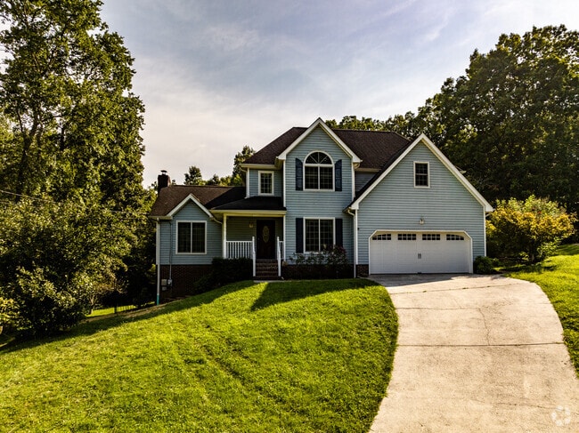Some homes in Ooltewah feature paved driveways and garages.