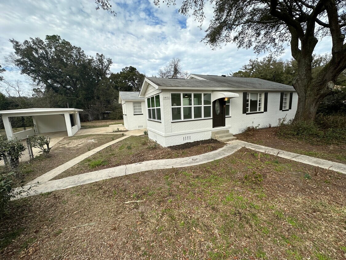 Front with yard and carport - 3402 W Lee St