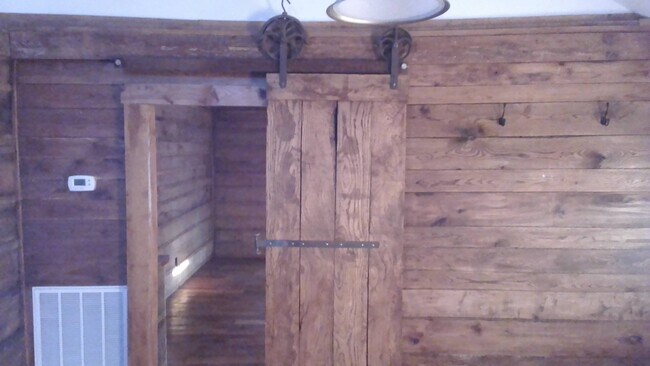 rolling barn door going from livingroom to be - 6832 Piney River Rd N