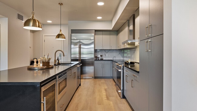 Modern kitchen with sleek finishes in the Jade model - The Residences At Sugar Alley