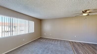 Located at 11383 Magnolia Ave in Riverside, CA, this single-story 1-bedroom, 1-bathroom unit offers a well-organized and efficient layout across its single floor. The living room features a ceiling fan, a large window with vertical blinds that brings in natural light, and a combination of hardwood-style and plush carpeted flooring. A separate dining room adds structure to the living area, while the kitchen is outfitted with ample cabinetry, a ceiling fan, a range, refrigerator, and a sink beneath a window.

The bedroom is a comfortable, carpeted space with natural light from a window fitted with vertical blinds, a sliding-door closet for generous storage, and direct access to the full bathroom. The bathroom includes a tub/shower combo, a vanity with a speckled granite-style countertop, and a large mirror with overhead lighting. Throughout the unit, warm neutral-toned walls and textured ceilings create a cohesive, understated aesthetic. Three closets and two utility areas provide practical storage solutions. The overall layout is thoughtfully designed for functionality, making efficient use of every square foot.