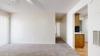 Located at 5101 Sanger Ave in Waco, Texas, this single-story, 2-bedroom, 1-bathroom home offers a practical and comfortable layout. The living room is a welcoming space featuring plush carpet, a tile-surround fireplace, a ceiling fan with light fixture, and a sliding glass door that invites natural light and outdoor access. A dedicated entry door adds convenience and privacy. The kitchen is well-appointed with warm wood cabinetry, a mosaic tile backsplash, black appliances including a gas range and dishwasher, light wood flooring, and ample counter space. The primary bedroom is generously sized, complete with carpet flooring, a ceiling fan, and a walk-in closet with built-in shelving. The second bedroom features carpet flooring and a window with natural light. The full bathroom includes a tub-shower combination with white tile surround and wood-look flooring. An in-unit laundry area accommodates a full-size washer and dryer. Throughout the home, textured ceilings and neutral tones create a clean, cohesive aesthetic suited to a variety of furnishing styles.