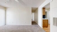 Located at 5101 Sanger Ave in Waco, Texas, this single-story, 2-bedroom, 1-bathroom home offers a practical and comfortable layout. The living room is a welcoming space featuring plush carpet, a tile-surround fireplace, a ceiling fan with light fixture, and a sliding glass door that invites natural light and outdoor access. A dedicated entry door adds convenience and privacy. The kitchen is well-appointed with warm wood cabinetry, a mosaic tile backsplash, black appliances including a gas range and dishwasher, light wood flooring, and ample counter space. The primary bedroom is generously sized, complete with carpet flooring, a ceiling fan, and a walk-in closet with built-in shelving. The second bedroom features carpet flooring and a window with natural light. The full bathroom includes a tub-shower combination with white tile surround and wood-look flooring. An in-unit laundry area accommodates a full-size washer and dryer. Throughout the home, textured ceilings and neutral tones create a clean, cohesive aesthetic suited to a variety of furnishing styles.