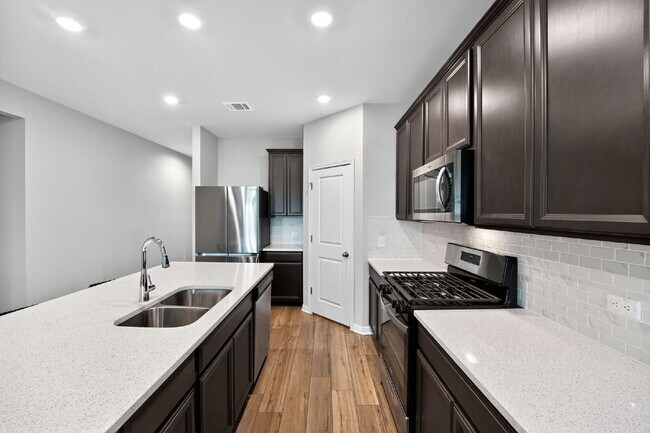 Building Photo - Modern 4-Bedroom Rental in ShadowGlen – Sp...