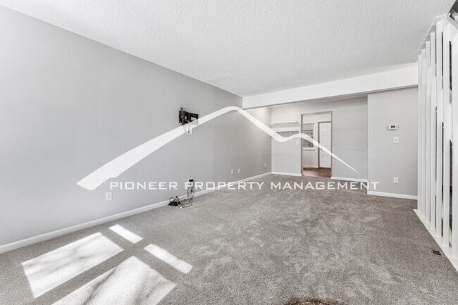 Building Photo - Updated Condo With 2 Covered Parking Spots...
