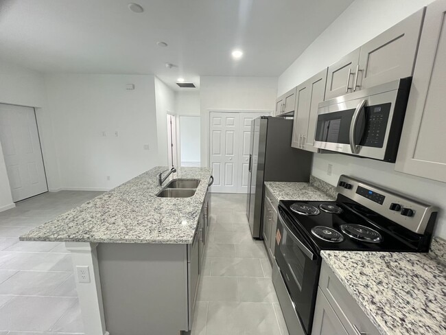 Building Photo - ONE OF A KIND! BRAND NEW 1 Bedroom-1 Bath- 1 Car Garage in Desirable Lehigh Acres!