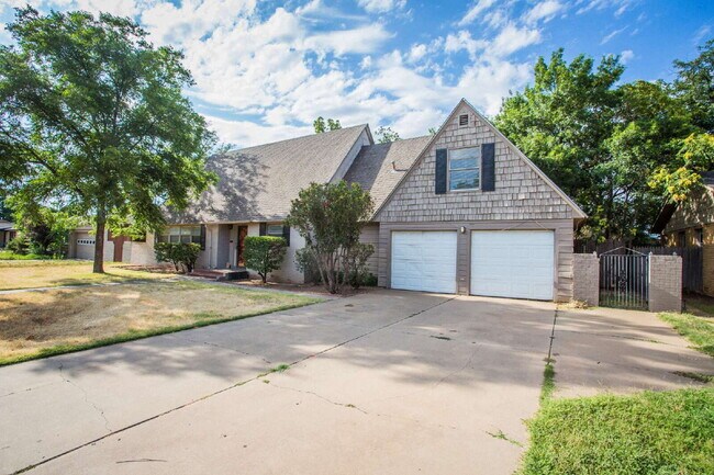 Foto del edificio - "Spacious 5-Bed Oasis with Granite Elegance & Hardwood Charm in Lubbock!"