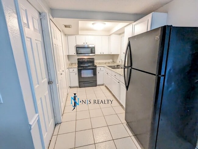 Building Photo - REDUCED!! NEW FLOORS, NEW PAINT INSIDE & O...