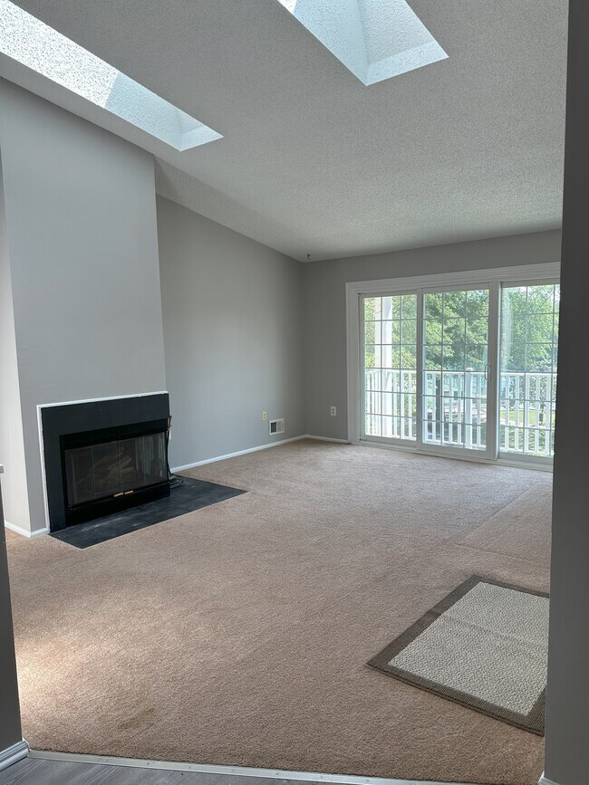 Large Living Room with Fireplace, Skylights and Balcony - 354 Wimbeldon Ct
