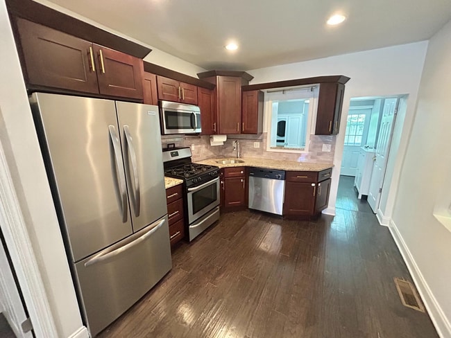 Photo - Spacious 3-Bedroom Home with Central Air, In-Unit Laundry and Patio