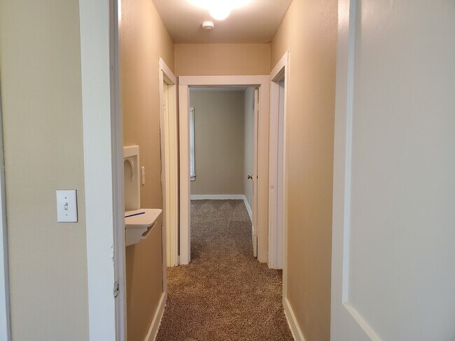 Hallway & Bedrooms Carpeted - 305 E Sabine St