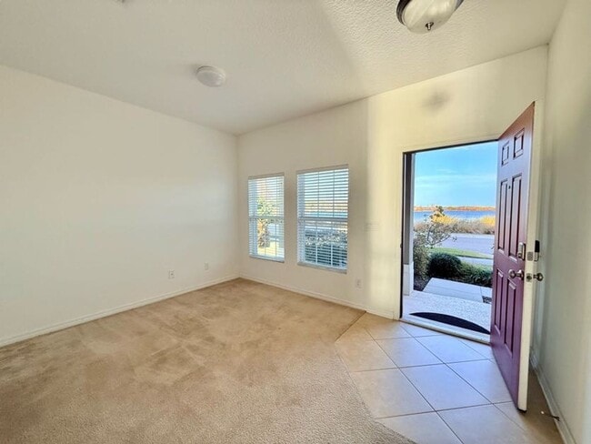 Building Photo - Stunning 4/2.5 in Highly Sought After Waterside Community!