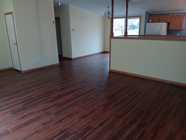 Livingroom facing dining area and hall - 70966 Hilltop Dr