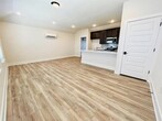 living room and kitchen. First door is laundry - 8004 Corrigan Pass