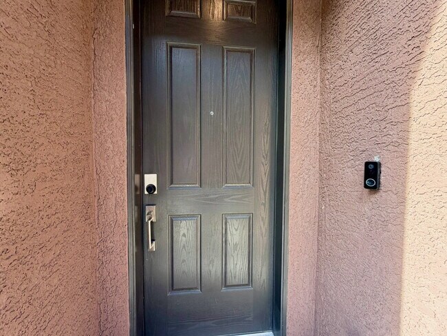 Building Photo - GATED 3 BED 2.5 BATH TOWNHOME WITH 2-CAR GARAGE, COVERED PATIO & COMMUNITY POOL