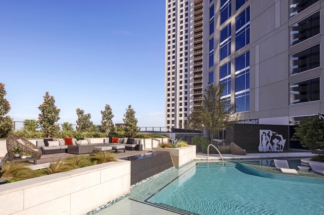 Unwind poolside with skyline views and resort-style comfort. - Brava