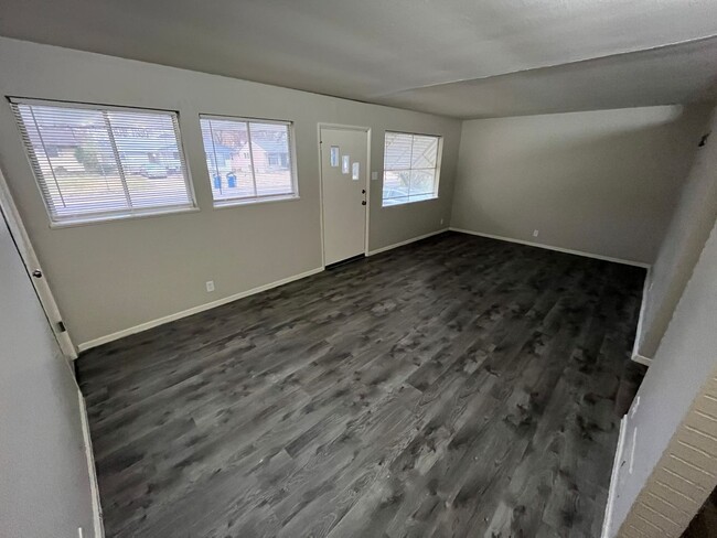 Building Photo - Newly Renovated Three Bedroom Coming Avail...