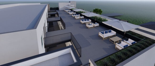 Roof Top Deck with Firepits and Grills - Backhouse Apartments