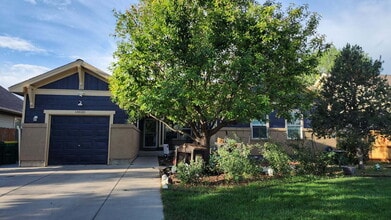 Building Photo - Spacious 5-Bed Retreat with Modern Updates in Aurora. Included - Greenhouse and Shed!