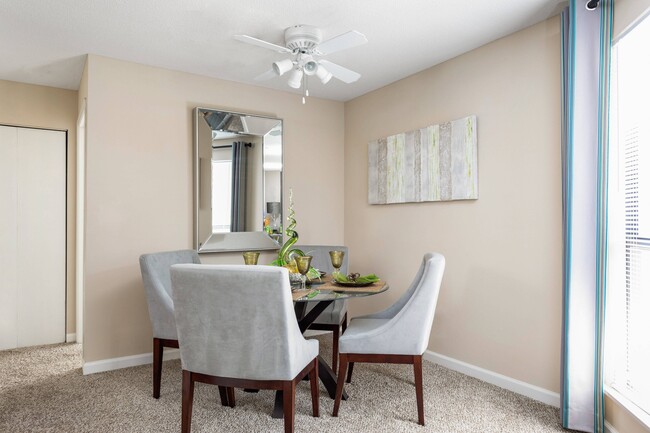 Charming Dining Area with Ceiling Fan - Brookside Apartments