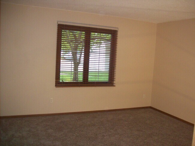 Bedroom with large window and closet - 3545 Blue Jay Way