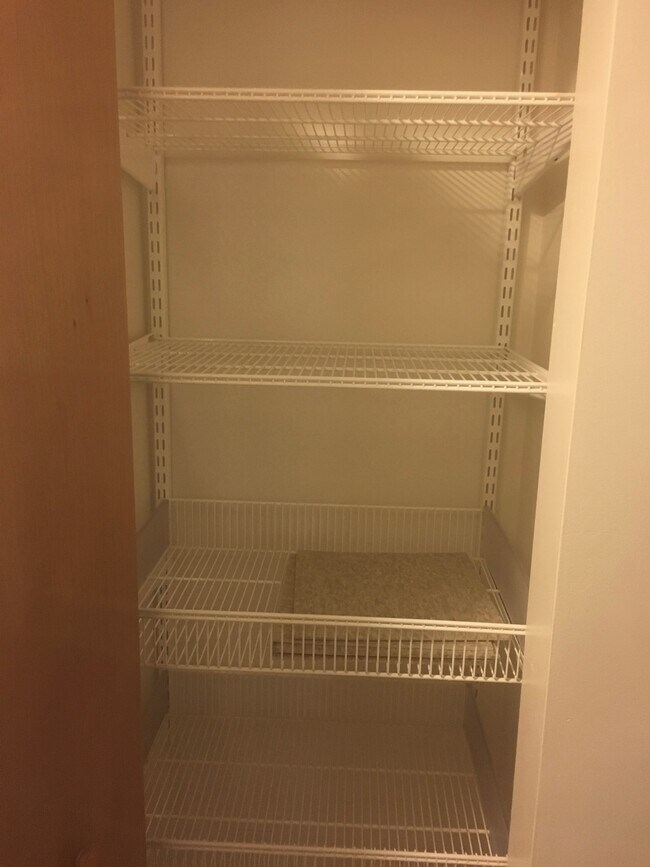 Hall closet garden level - 3244 N Monticello Ave