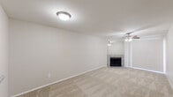 Located at 12919 Windfern Road in Houston, TX, this single-story 2-bedroom, 1-bathroom home offers a practical and well-appointed layout. The living area is carpeted and features a tile-surround fireplace, a ceiling fan, and a clean, neutral color palette that creates a bright and welcoming atmosphere. The galley-style kitchen is thoughtfully designed with white cabinetry, granite-look countertops, a stainless steel double sink, wood-look flooring, and black appliances including a range, microwave, and dishwasher. Natural light filters in through a window with blinds. Both bedrooms are carpeted and equipped with ceiling fans; the primary bedroom offers a comfortable, well-sized layout with a closet, while the second bedroom also includes natural light via a window with blinds. The full bathroom features wood-look tile flooring, a tiled tub-shower combination, and a granite-accented vanity. Additional conveniences include a dedicated closet and an in-unit laundry area. The home's neutral tones, updated finishes, and functional floor plan make it a practical living space in the Houston area.