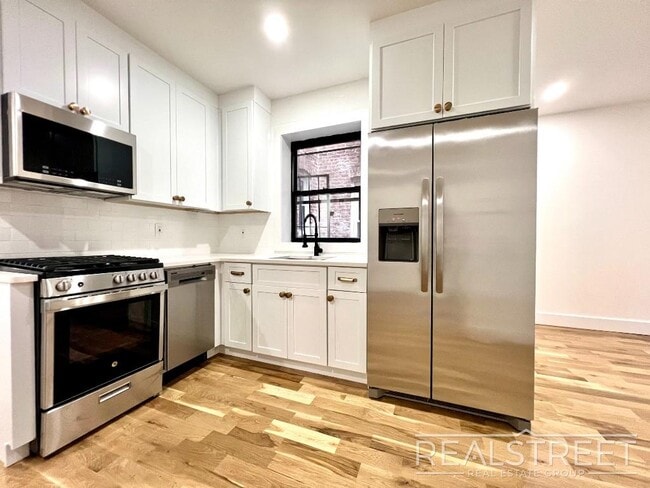 Building Photo - BRAND NEW 4 BED 2 BATH WITH W/D IN UNIT!