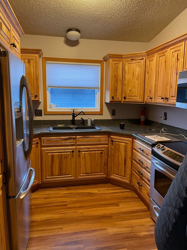Kitchen with hickory cabinets - 2533 La Honda Dr