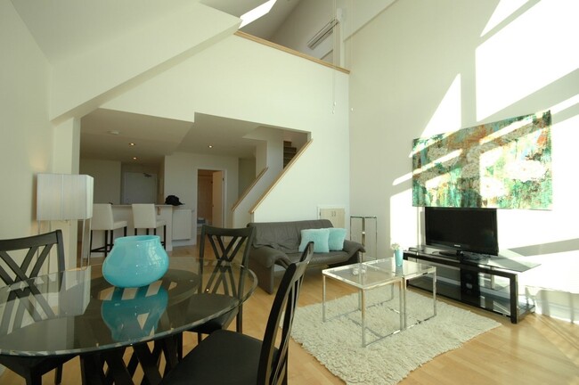 Building Photo - Stunning Two Level Penthouse with One Full...