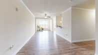 Located at 101 Halehaven Dr in Duncan, SC, this well-appointed one-bedroom, one-bathroom home offers a comfortable and functional single-floor layout. The open-concept living and dining area is a central highlight, featuring warm hardwood-style flooring, crown molding, and a ceiling fan that enhances air circulation. Natural light pours in through large windows fitted with blinds, offering pleasant outdoor views of the surrounding greenery.

The kitchen is a standout feature, equipped with rich wood cabinetry, granite countertops, black appliances including a range, microwave, refrigerator, and dishwasher, along with a double sink and pendant lighting. It connects seamlessly to the dining area, which is finished with tile flooring, chair-rail molding, and an elegant chandelier overhead.

The bedroom provides a comfortable retreat with hardwood-style flooring, a ceiling fan, and a generously sized window that brings in natural light. The full bathroom includes a tub/shower combination with a curved curtain rod and tile flooring.

A dedicated laundry room with tile flooring, wire shelving, and washer/dryer hookups adds practicality to this thoughtfully designed home. Clean, neutral tones throughout create a bright and inviting ambiance.