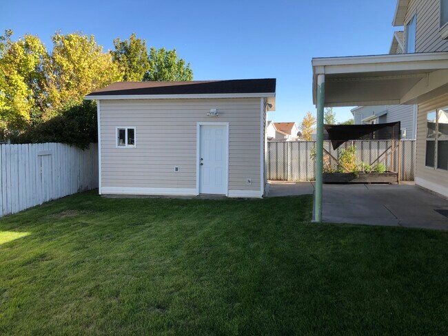 Backyard showing shed - 5542 S 4175 W