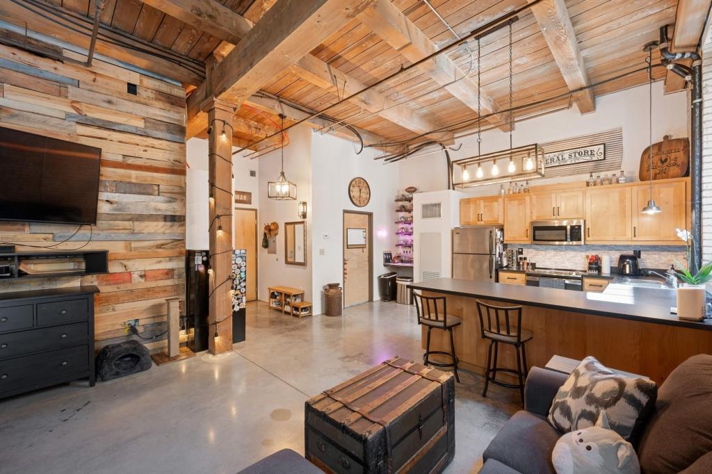 Living Room Looking Towards Front Entry, Bathroom, and Kitchen - 127 5th St NE
