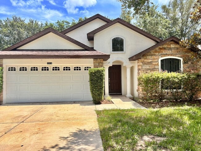 Building Photo - Large 4/2 with new floors in gated community!