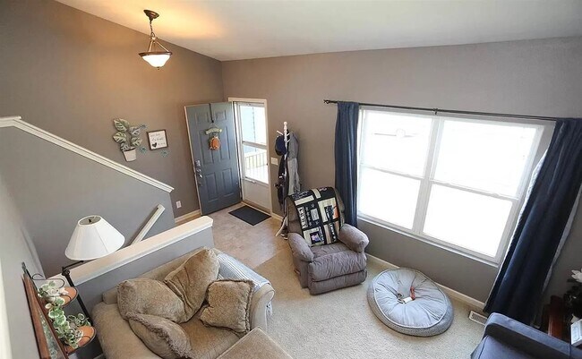 View of living room from the dining area - 6955 N 88th Ave