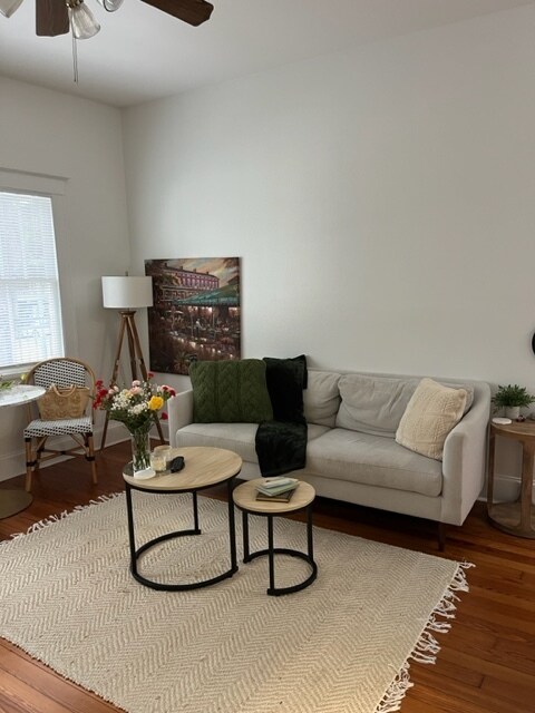 Living room with beautiful hardwood floors. - 618 N Carrollton Ave