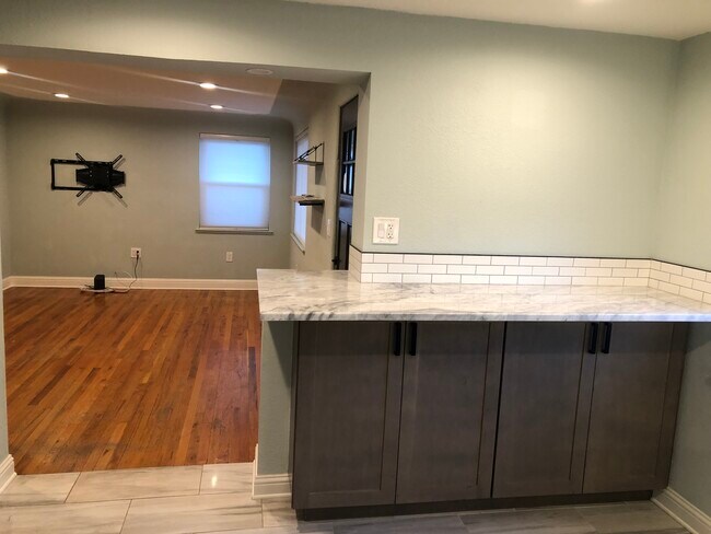 Kitchen leads into the family / living room... - 5045 Adams St