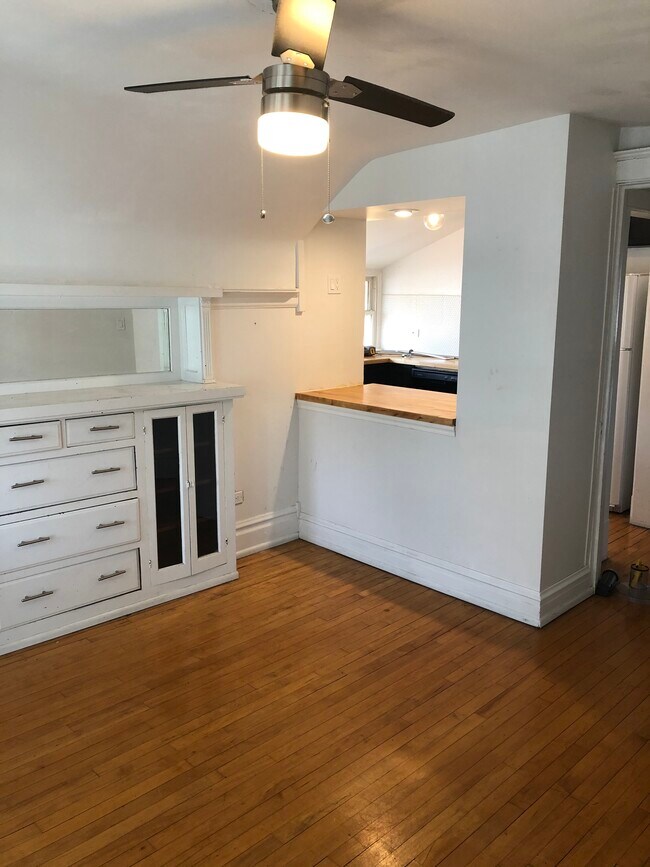 Dining with view to kitchen, vintage built-in (tile now in place in kitchen) - 831 S Grove Ave