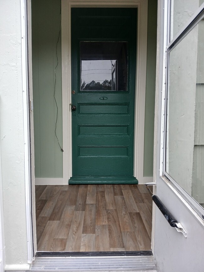 Entrance to apartment with small enclosed porch - 367 Portland St