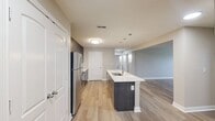 This renovated property, known as The Majestic, offers a harmonious blend of comfort and functionality across its 1,240 square feet. The home boasts three bedrooms and three bathrooms, distributed over two floors. The primary bedroom, measuring 160 square feet, provides ample space for relaxation.

The interior showcases a modern aesthetic with neutral tones and high-quality finishes. The bathrooms feature contemporary fixtures, including sleek vanities and ample storage. The kitchen is a highlight, with dark wood cabinetry contrasting beautifully against white subway tile backsplash and stainless steel appliances.

Throughout the home, wood-look flooring adds warmth and durability, while plush carpeting in the bedrooms ensures comfort underfoot. Large windows in the living areas and bedrooms allow for abundant natural light, creating a bright and inviting atmosphere.

Additional amenities include a laundry room with modern appliances, two closets for storage, and an attached garage. The property's layout, with its open-concept living areas and well-appointed bedrooms, is designed for practical family living.

Located in Noblesville, Indiana, this renovated home combines contemporary design with suburban convenience, making it an attractive option for those seeking a modern living space in a desirable area.