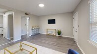 Located in Smyrna, GA, this well-designed one-bedroom, one-bathroom unit offers a thoughtfully utilized single-floor layout. The open living room is bright and welcoming, featuring wood-look flooring, neutral gray walls, and natural light from large windows with blinds. The space flows naturally toward the kitchen, which boasts white shaker cabinets, subway tile backsplash, dark countertops, stainless steel appliances including a full-size refrigerator and dishwasher, and the convenience of in-unit laundry. A pantry provides additional storage. The bedroom is a cozy retreat with a ceiling fan, a sliding-door closet, and a natural light window. A second closet in the hallway adds extra storage capacity. The clean, all-white bathroom includes a tub/shower combination, a window for ventilation, and a vanity with storage. A utility room and an outdoor patio round out the unit's functional offerings. Throughout the space, consistent wood-look flooring, clean white trim, and a neutral color palette create a cohesive, modern ambiance that feels polished and move-in ready.
